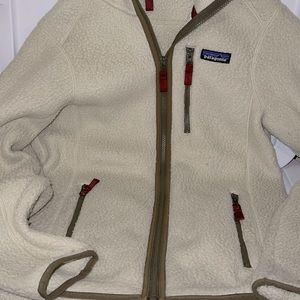 Patagonia outer jacket zip up with hoodie . Has zip pockets and mesh lining